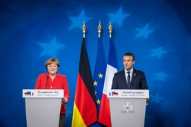 Tổng thống Pháp Emmanuel Macron và Thủ tướng Đức Angela Merkel. (Ảnh: AFP/TTXVN)