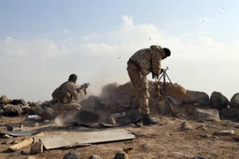 Các lực lượng Syria tại khu vực Sawwan, phía nam Khanasser, khi đang trên đường tiến về khu vực phiến quân kiểm soát tại Idlib ngày 19/11 vừa qua. (Ảnh: AFP/TTXVN)