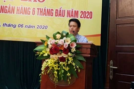 Ông Phạm Tiến Dũng, Vụ trưởng Vụ Thanh toán Ngân hàng Nhà nước trao đổi tại họp báo. (Ảnh: PV/Vietnam+)