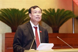 Chủ nhiệm Ủy ban Quốc phòng và An ninh của Quốc hội Lê Tấn Tới trình bày Báo cáo giải trình, tiếp thu, chỉnh lý dự thảo Luật Căn cước. (Ảnh: Doãn Tấn/TTXVN)