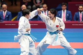 Bài thi của các võ sỹ Việt Nam trong trận Chung kết nội dung Kata đồng đội Nữ tại ASIAD 2023. (Ảnh: Hoàng Linh/TTXVN)