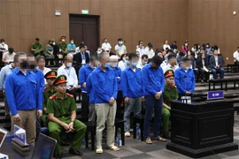 Các bị cáo tại phiên tòa. (Ảnh: Phạm Kiên/TTXVN)