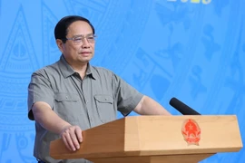 Thủ tướng Phạm Minh Chính chủ trì Hội nghị tổng kết Công tác Phòng, Chống dịch COVID-19. (Ảnh: Dương Giang/TTXVN)