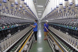 Nhà máy sợi Hòa Xá, Tổng Công ty Cổ phần dệt may Nam Định. (Ảnh: Trần Việt/TTXVN)