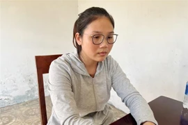 Trần Thị Huyền tại cơ quan công an. (Ảnh: TTXVN phát)