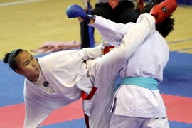 Các vận động viên thi đấu Kumite cá nhân nữ trong ngày khai mạc. (Ảnh: Thanh Tùng/TTXVN)