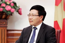 Bộ trưởng Ngoại giao Phạm Bình Minh trả lời phỏng vấn báo chí về chuyến thăm Trung Quốc của Chủ tịch nước. (Ảnh: Lâm Khánh/TTXVN)