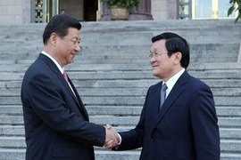 Chủ tịch nước Cộng hòa Nhân dân Trung Hoa Tập Cận Bình đón Chủ tịch nước Trương Tấn Sang. (Ảnh: Nguyễn Khang/TTXVN)