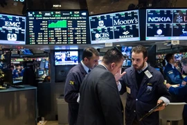 Sàn giao dịch chứng khoán New York ngày 4/12 vừa qua. (Ảnh: AFP/TTXVN)