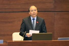 Phó Thủ tướng Chính phủ Nguyễn Xuân Phúc trả lời chất vấn. (Ảnh: Phương Hoa/TTXVN)