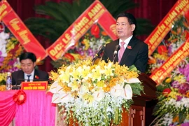 Ông Hồ Đức Phớc, Bí thư Tỉnh ủy Nghệ An trình bày Báo cáo chính trị tại Đại hội, sáng 13/10. (Ảnh: Thanh Tùng/TTXVN)