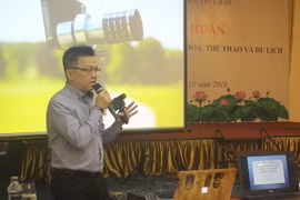 Phó Tổng Giám đốc Thông tấn xã Việt Nam Lê Quốc Minh thuyết trình tại Hội nghị. (Ảnh: Hoa Mai/Vietnam+)