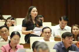 Đại biểu Quốc hội tỉnh Thanh Hóa Cầm Thị Mẫn phát biểu ý kiến. (Ảnh: Doãn Tấn/TTXVN)