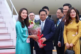 Lễ đón Thủ tướng Phạm Minh Chính tại sân bay Haneda, Tokyo. (Ảnh: Dương Giang/TTXVN)