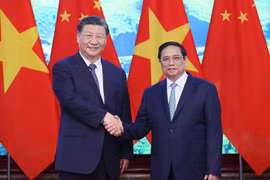 Thủ tướng Phạm Minh Chính và Tổng Bí thư, Chủ tịch nước Trung Quốc Tập Cận Bình chụp ảnh chung. (Ảnh: Dương Giang/TTXVN)