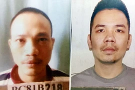 Tử tù Nguyễn Văn Tình (bên phải) và tử tù Lê Văn Thọ. (Nguồn: TTXVN)