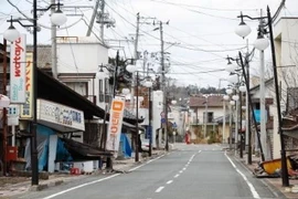 Cảnh vắng vẻ tại một con phố ở thị trấn Futaba, tỉnh Fukushima do người dân đi sơ tán sau thảm họa động đất và sóng thần năm 2011. (Nguồn: Kyodo/TTXVN)