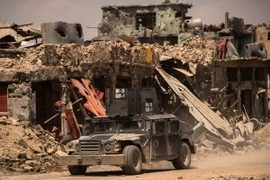 Các lực lượng Iraq tuần tra trên đường phố Mosul. (Nguồn: AFP/TTXVN)