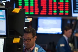 Giao dịch viên tại Sàn giao dịch chứng khoán New York, Mỹ. (Nguồn: AFP/TTXVN)