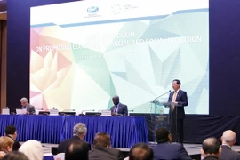 Quang cảnh Hội thảo Phát triển bao trùm về kinh tế, tài chính và xã hội. (Ảnh: Văn Điệp/TTXVN)