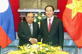 Chủ tịch nước Trần Đại Quang hội kiến Tổng Bí thư, Chủ tịch nước Lào Bounnhang Volachith. (Ảnh: Nhan Sáng/TTXVN)