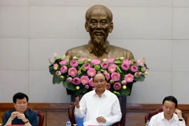 Thủ tướng Nguyễn Xuân Phúc chủ trì phiên họp Ủy ban Quốc gia về biến đổi khí hậu lần thứ 7. (Ảnh: Thống Nhất/TTXVN)