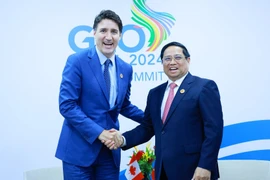 Thủ tướng Phạm Minh Chính gặp Thủ tướng Canada Justin Trudeau. (Ảnh: Dương Giang/TTXVN)