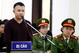 Bị cáo Trần Văn Khoa trả lời tại phiên tòa. (Ảnh: Trung Kiên/TTXVN)