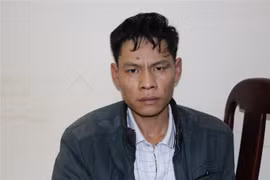 Đối tượng Vì Văn Toán tại cơ quan điều tra. (Ảnh: Xuân Tư/TTXVN)