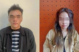 Hai đối tượng Võ Thị Thanh Lan và Nguyễn Tấn Long. (Ảnh: TTXVN phát)