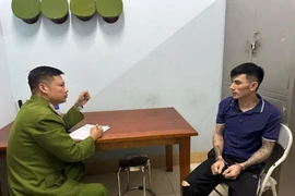 Đối tượng Lý Văn Vũ tại cơ quan Công an. (Nguồn: báo Công an Nhân dân)