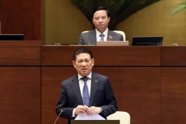Bộ trưởng Bộ Tài chính Hồ Đức Phớc trả lời chất vấn của đại biểu Quốc hội. (Ảnh: An Đăng/TTXVN)