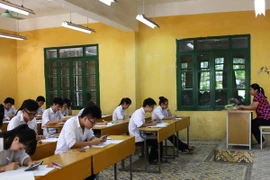 Thí sinh làm bài thi tốt nghiệp THPT. (Ảnh: Quý Trung/TTXVN)
