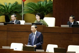 Bộ Trưởng Bộ Công an Tô Lâm giải trình ý kiến của đại biểu Quốc hội về dự án Luật quản lý sử dụng vũ khí, vật liệu nổ và công cụ hỗ trợ. (Ảnh: An Đăng/TTXVN)