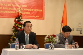 Bộ trưởng Bộ Lao động, Thương binh và Xã hội Đào Ngọc Dung và Đại sứ Việt Nam tại Nhật Bản Nguyễn Quốc Cường tại buổi tọa đàm. (Ảnh: Thành Hữu/Vietnam+)