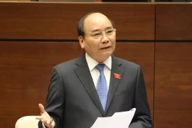 Thủ tướng Chính phủ Nguyễn Xuân Phúc trả lời chất vấn các đại biểu quốc hội. (Ảnh: Phương Hoa/TTXVN)