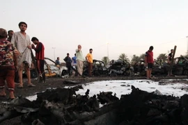 Hiện trường vụ đánh bom ở Iraq ngày 15/8. (Nguồn: AFP/TTXVN)