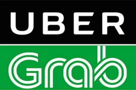 Biểu tượng Grab và Uber. (Nguồn: BBC/TTXVN)