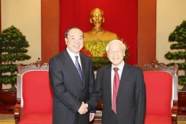 Tổng Bí thư Nguyễn Phú Trọng và ông Hoàng Khôn Minh, Bí thư Ban Bí thư, Trưởng Ban Tuyên truyền Trung ương Đảng Cộng sản Trung Quốc. (Ảnh: Trí Dũng/TTXVN)