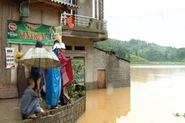 Thôn Cốc Chứ, xã Nấm Lư, nước ngập sâu đến vài mét. (Ảnh: Hương Thu/TTXVN)