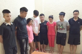 Các đối tượng tại cơ quan công an. (Ảnh: Doãn Tấn/TTXVN)