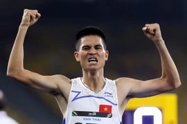 Vận động viên Dương Văn Thái vui mừng sau khi về nhất. (Ảnh: Quốc Khánh/TTXVN)