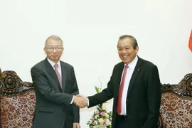 Phó Thủ tướng Thường trực Trương Hòa Bình tiếp Chánh án Toà án Tối cao Hàn Quốc ông Yang Sung Tae đang thăm và làm việc tại Việt Nam. (Ảnh: Nguyễn Dân/TTXVN)