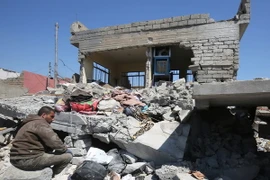 Cảnh đổ nát sau các vụ không kích của liên quân chống IS tại Iraq. (Nguồn: AFP/ TTXVN)
