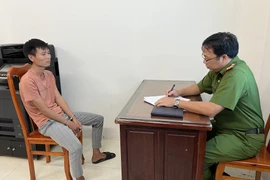 Đối tượng Nguyễn Hữu Dương tại Cơ quan Công an. (Ảnh: TTXVN)