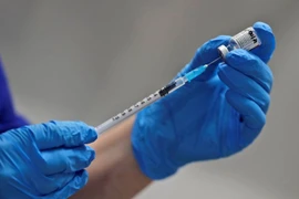 Singapore là quốc gia châu Á đầu tiên phê duyệt vaccine Covid-19 của Pfizer. Ảnh: Reuters. 