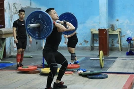 VĐV Lại Gia Thành, hy vọng vàng của cử tạ Việt Nam tại SEA Games 32. (Ảnh: Tuấn Anh/TTXVN) 