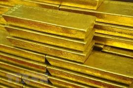 Giá vàng thế giới đi lên khi Fed tiếp tục tăng lãi suất