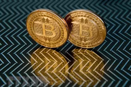 Đồng tiền kỹ thuật số bitcoin. (Ảnh: AFP/TTXVN) 