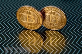 Đồng tiền kỹ thuật số bitcoin. (Ảnh: AFP/TTXVN)